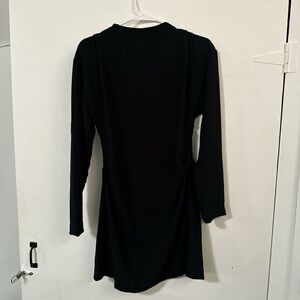 Black long sleeve dress with a zipper on the side
